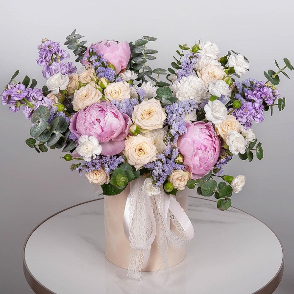 Peony pink - 3, Peony sprayrose - 2, Baltica White Spray Chrysanthemum - 2, White spray carnation - 7, Matthiola Lilac - 3, Round flower box small , Oasis, Blue Statice, Eucalyptus, Ribbon