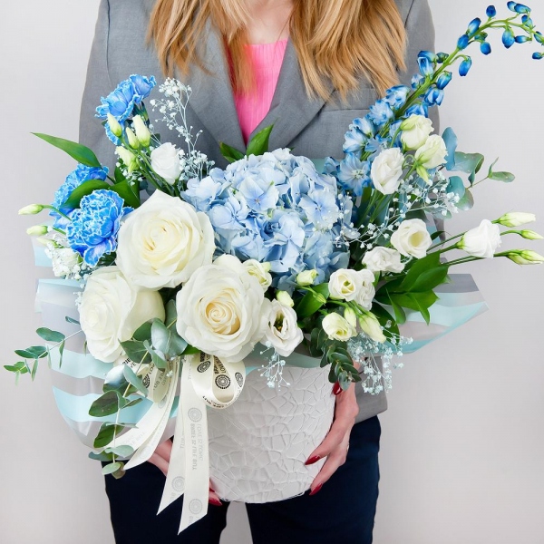 Blue/purple hydrangea - 3, Blue carnation - 5, White rose 50 cm - 5, lisianthus - 4, Colored gypsophila - 2, Round flower box small , Oasis, Wrapping Paper, Ruscus, Eucalyptus Cinerea, Blue Delphinium