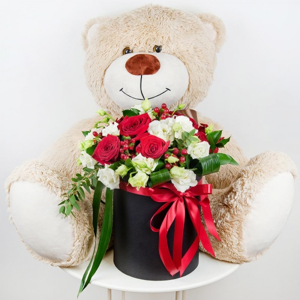 Red rose 50 cm - 15, lisianthus - 8, Round flower box medium, Oasis, Film, Ruscus, Aspidistra (1 pc.), Hypericum, Eucalyptus parvifolia (1 pc.), Teddy bear 70 cm, Ribbon