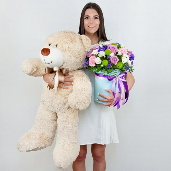 Deep Purple rose - 7, Spray rose: white, cream, light pink 50 cm - 11, Pink carnation - 5, Irises - 5, Athos pom Feeling Green - 4, Round flower box medium, Oasis, Film, Pistachio, Blue Statice, Teddy bear 70 cm, Ribbon
