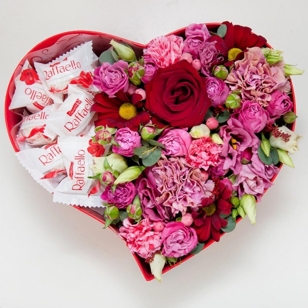 Red rose 50 cm - 2, Pink carnation - 3, Pink spray carnation - 2, Pink Lisianthus (Eustoma) - 1, Bacardi Red Spray Chrysanthemum - 2, Bright pink spray rose mix, 50 cm - 3, Heart‑shaped box for arrangements, Oasis, Film, Box of candies «Raffaello» 150 g, Hypericum, Eucalyptus Cinerea
