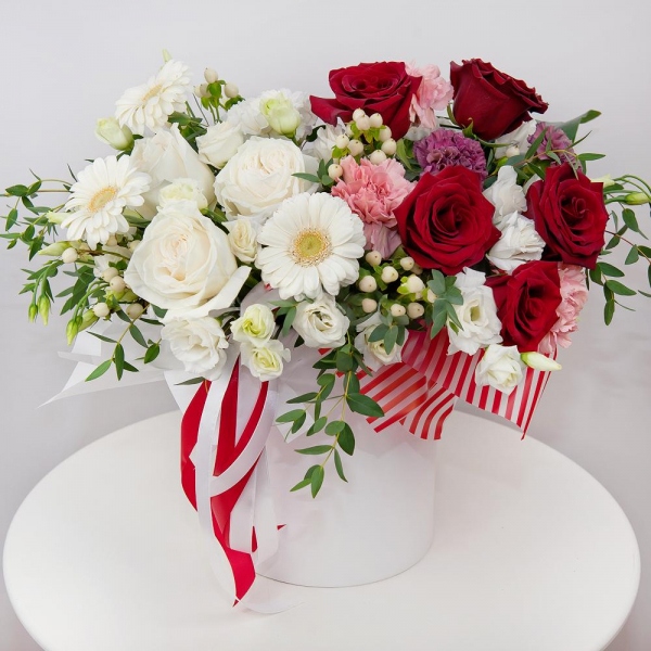 White rose 50 cm - 5, Red rose 50 cm - 7, Carnation white, cream - 4, lisianthus - 5, Gerbera white - 5, Pink carnation - 4, Lilac carnation - 5, Round flower box small , Oasis, Wrapping Paper, Hypericum, Eucalyptus parvifolia (1 pc.), Aspidistra (1 pc.)