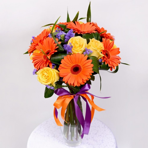 Gerbera daisies - 11, Yellow rose 50 cm - 13, Aspidistra (1 pc.), Blue Statice, Ribbon, Ribbon