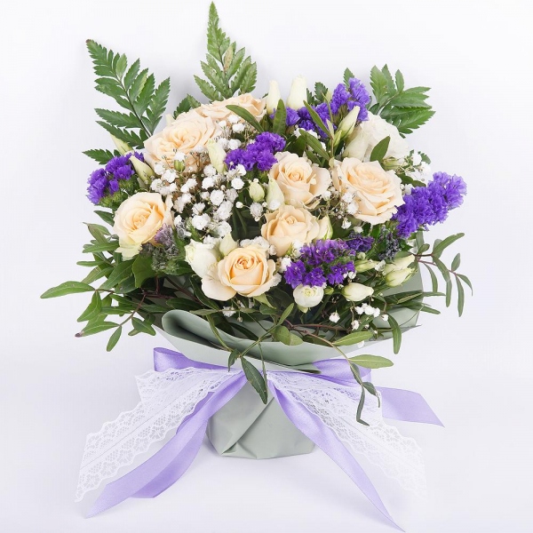 Spray rose: white, cream, light pink 50 cm - 3, Gypsophila - 1, lisianthus - 1, Blue Statice, Oasis, Pistachio, Fern (1 pc.), Wrapping Paper