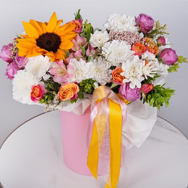 Sunflower - 1, Alstromeria white, soft pink - 4, Bright pink spray rose mix, 50 cm - 2, Baltica White Spray Chrysanthemum - 2, Spray rose: yellow, orange 50 cm - 2, Round flower box small , Oasis, Ozotamnus, Pistachio, Limonium (1 pc.), Wrapping Paper