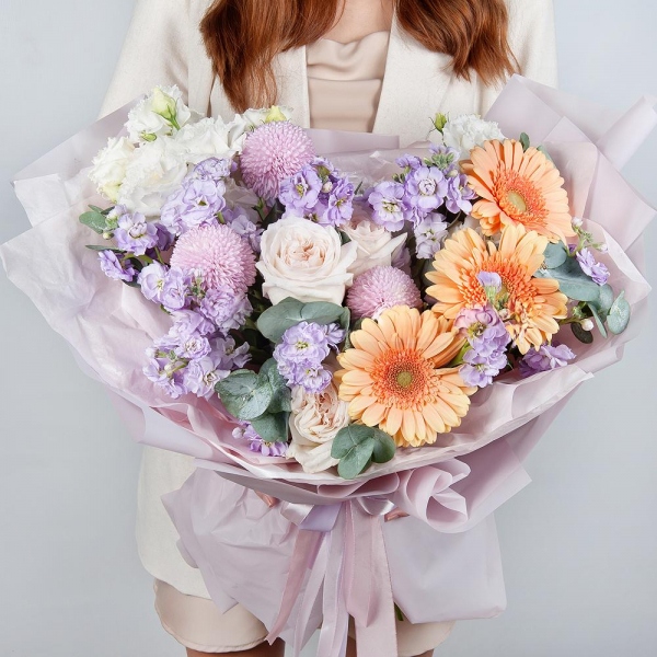 Cream gerbera - 7, Peony style roses - 3, Momoko Chrysanthemum - 3, Matthiola Lilac - 5, lisianthus - 3, Eucalyptus, Wrapping Paper