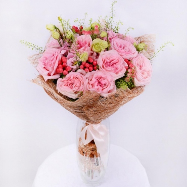 Peony style roses - 9, lisianthus - 4, Green bell (1 pc.), Hypericum, Mesh (Abaka), Ribbon