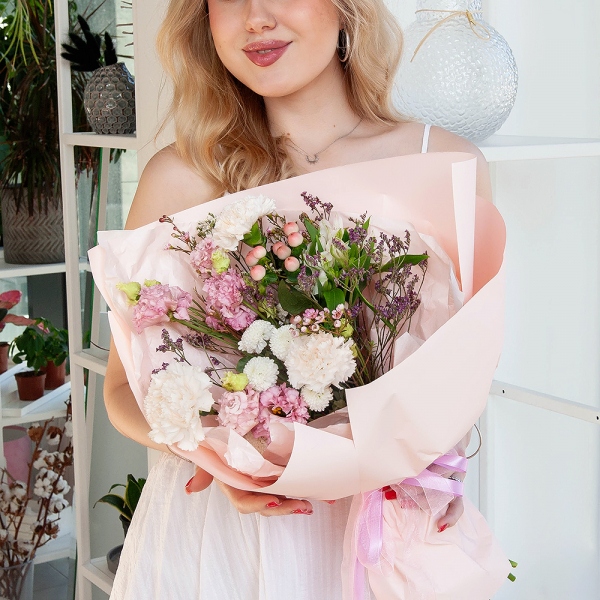 Carnation white, cream - 7, Newton White Spray Chrysanthemum - 1, Alstromeria white, soft pink - 2, Pink Lisianthus (Eustoma) - 2, Hypericum, Limonium (1 pc.), Waxflower (1 pc.), Wrapping Paper