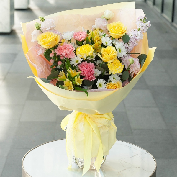 Pink carnation - 5, Yellow carnation - 4, Alstromeria Yellow, Orange - 7, Rose Yellow 50 cm Ecuador (Mohana, Latina, Brighton) - 9, Pink Lisianthus (Eustoma) - 3, Bacardi White Spray Chrysanthemum - 3, Pink Matthiola - 1, Hypericum, Wrapping Paper, Eucalyptus baby blue (1 pc.)
