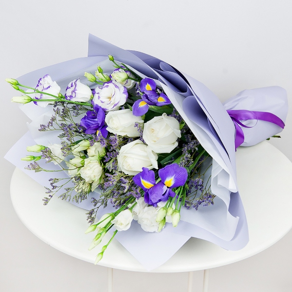 Irises - 4, lisianthus - 1, White rose 50 cm - 5, Spray rose: white, cream, light pink 50 cm - 2, Purple Lisianthus (Eustoma) - 2, Limonium (1 pc.), Wrapping Paper