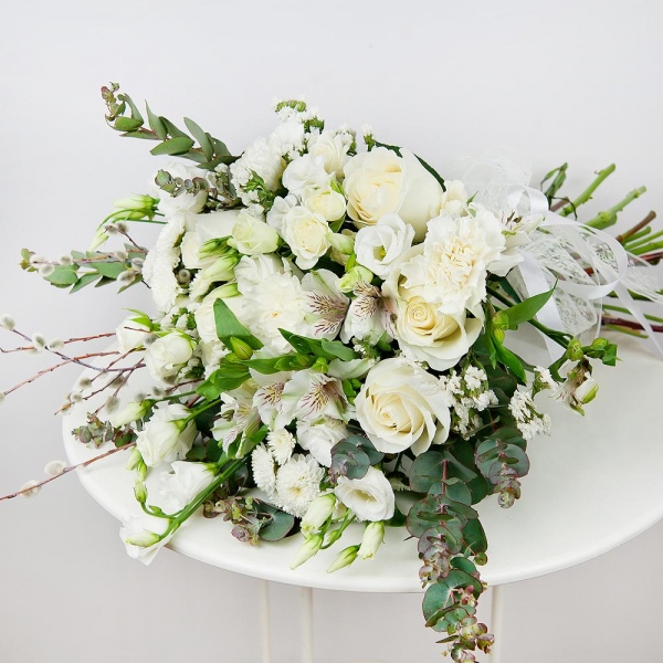 White rose 50 cm - 7, Spray rose: white, cream, light pink 50 cm - 3, Alstromeria white, soft pink - 2, Baltica White Spray Chrysanthemum - 4, Carnation white, cream - 4, lisianthus - 3, White statice, Bunch of willows, Ribbon, Eucalyptus Cinerea