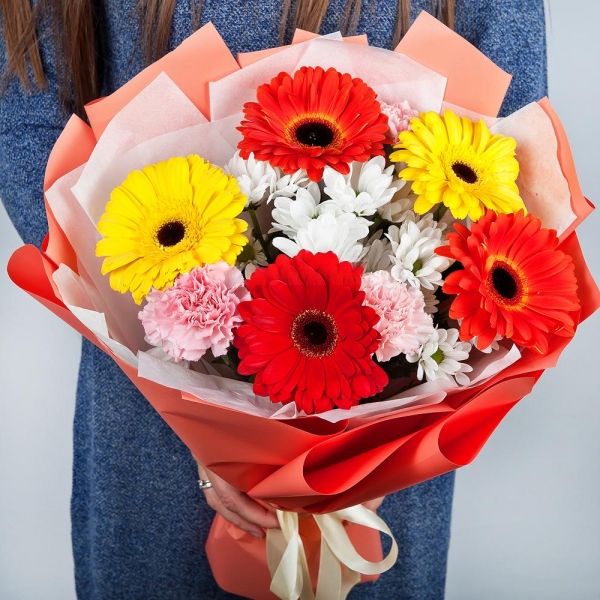 Gerbera daisies - 3, Bacardi White Spray Chrysanthemum - 3, Pink carnation - 5, Gerbera yellow - 3, Gerbera red - 3, Wrapping Paper, Ribbon