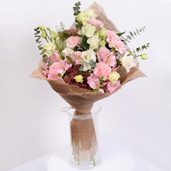 Pink carnation - 12, Alstromeria white, soft pink - 4, lisianthus - 7, Sedum, Ruscus, Green bell (1 pc.), Eucalyptus baby blue (1 pc.), Sackcloth, 1m, Ribbon