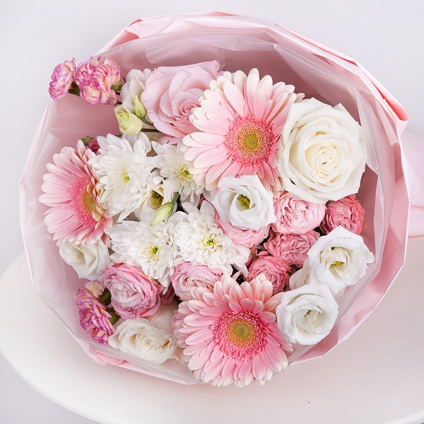 Gerbera pink - 5, Pink rose 50 cm - 3, White rose 50 cm - 3, Baltica White Spray Chrysanthemum - 1, Peony sprayrose - 2, Pink spray carnation - 2, lisianthus - 2, Wrapping Paper