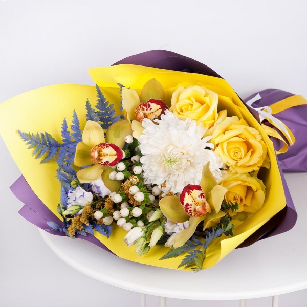 Magnum White Chrysanthemum - 2, Orchid bud yellow/brown Cymbidium - 3, Purple Lisianthus (Eustoma) - 4, Yellow rose 50 cm - 4, Flask for orchids, Hypericum, Solidago (1 pc.), Fern (1 pc.), Wrapping Paper