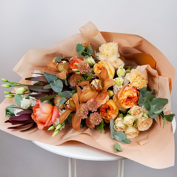 Orchid bud yellow/brown Cymbidium - 5, Athos poms Stallion - 4, Spray rose: white, cream, light pink 50 cm - 4, lisianthus - 2, Carnation white, cream - 7, Pink-orange rose Phoenix 50 cm - 7, Flask for orchids, Leukodendron, Eucalyptus Cinerea, Pistachio, Wrapping Paper