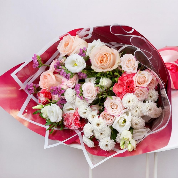 Athos poms Stallion - 4, Spray rose: white, cream, light pink 50 cm - 3, Rose Cream 50 cm - 5, Pink carnation - 3, lisianthus - 1, Pink Statice, Pistachio, Wrapping Paper