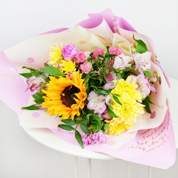 Sunflower - 1, Baltica Yellow Spray Chrysanthemum - 2, Alstromeria white, soft pink - 3, Pink spray carnation - 3, Bright pink spray rose mix, 50 cm - 2, Pistachio, Wrapping Paper