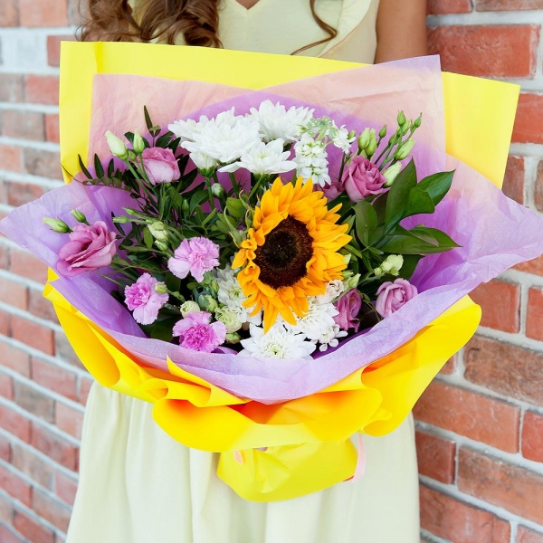 Baltica White Spray Chrysanthemum - 3, Pink Lisianthus (Eustoma) - 3, Pink spray carnation - 2, White Matthiola - 2, Sunflower - 1, Pistachio, Ruscus, Wrapping Paper