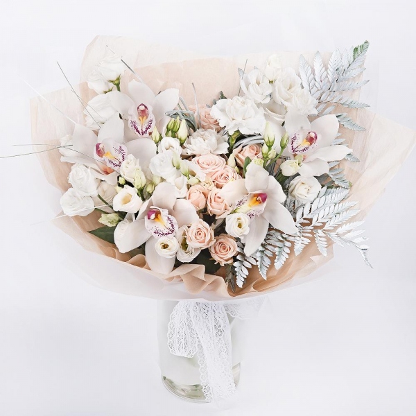 Spray rose: white, cream, light pink 50 cm - 7, Carnation white, cream - 5, lisianthus - 4, Flask for orchids, Fern (1 pc.), Beargrass (1 pc.), Wrapping Paper