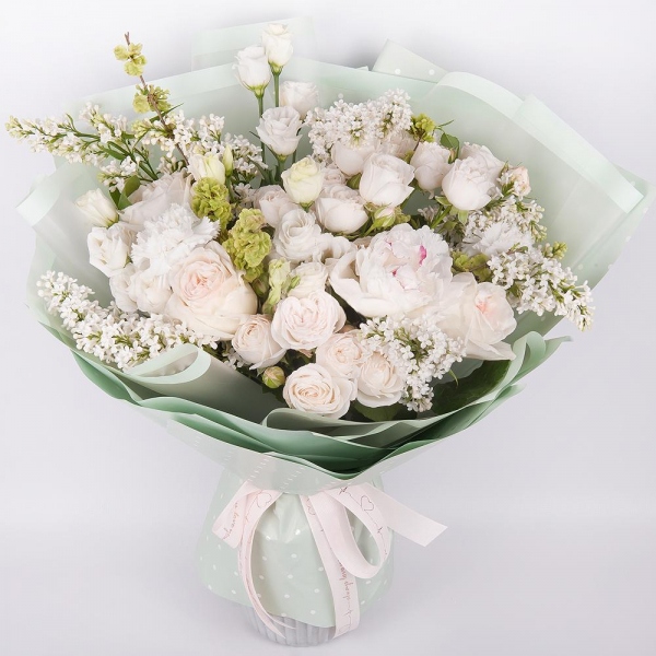 Peony white - 1, Peony style roses - 5, Peony sprayrose - 5, lisianthus - 3, Carnation white, cream - 6, White Lilac - 3, Wrapping Paper, Ribbon