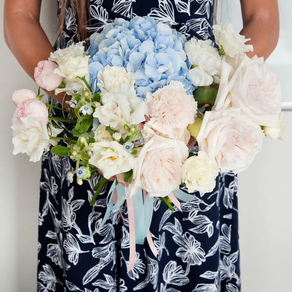 Blue/purple hydrangea - 1, Carnation white, cream - 9, lisianthus - 4, Spray rose: white, cream, light pink 50 cm - 3, White rose 50 cm - 7, Peony style roses - 3, Oksipetalum, Ribbon