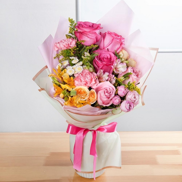 Pink rose 50 cm - 6, Spray rose: white, cream, light pink 50 cm - 2, Peony sprayrose - 1, Athos poms Stallion - 4, Pink carnation - 4, Alstromeria Yellow, Orange - 3, Alstromeria white, soft pink - 2, Solidago (1 pc.), Wrapping Paper
