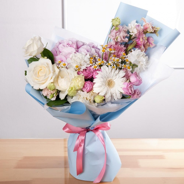 Gerbera white - 1, Pink Hydrangea - 1, Carnation white, cream - 5, Chamomile - 3, Peony sprayrose - 2, White rose 50 cm - 5, Pink Gladiolus - 2, lisianthus - 2, Pink Lisianthus (Eustoma) - 1, Wrapping Paper