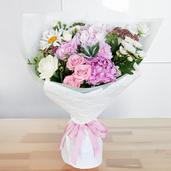 Bright pink spray rose mix, 50 cm - 1, Pink Matthiola - 2, White rose 50 cm - 3, lisianthus - 1, Santini White Spray Chrysanthemum - 2, Pink Hydrangea - 1, Pink carnation - 4, Chamomile - 1, Peony pink - 1, White statice, Ozotamnus, Ruscus, Pistachio, Wrapping Paper