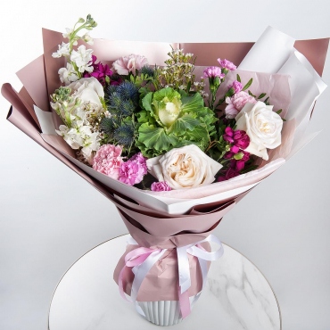 Peony style roses - 3, Matthiola Lilac - 2, Carnation spray - 4, Carnations - 3, Waxflower (1 pc.), Eryngium, Pistachio, Wrapping Paper, Brassica