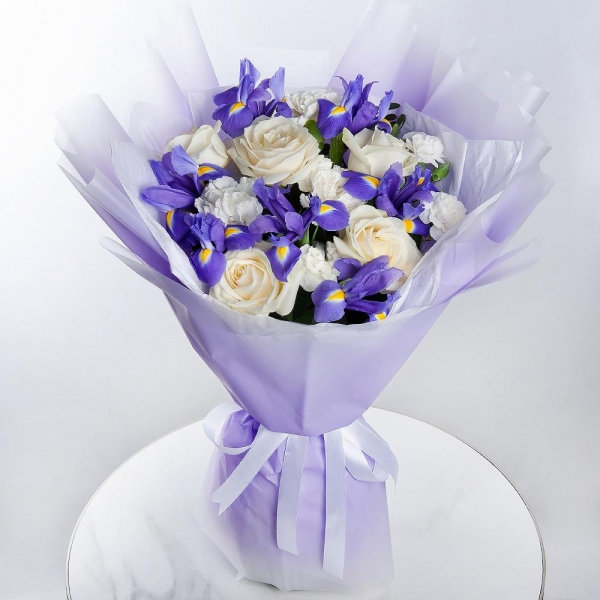 Irises - 9, White rose 50 cm - 5, White spray carnation - 2, Carnation white, cream - 5, Wrapping Paper