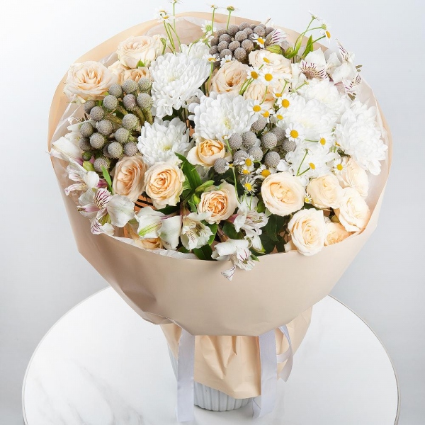 Spray rose: white, cream, light pink 50 cm - 4, Baltica White Spray Chrysanthemum - 3, Alstromeria white, soft pink - 5, Chamomile - 3, Brunia Green Lanuginosa (1 pc.), Wrapping Paper