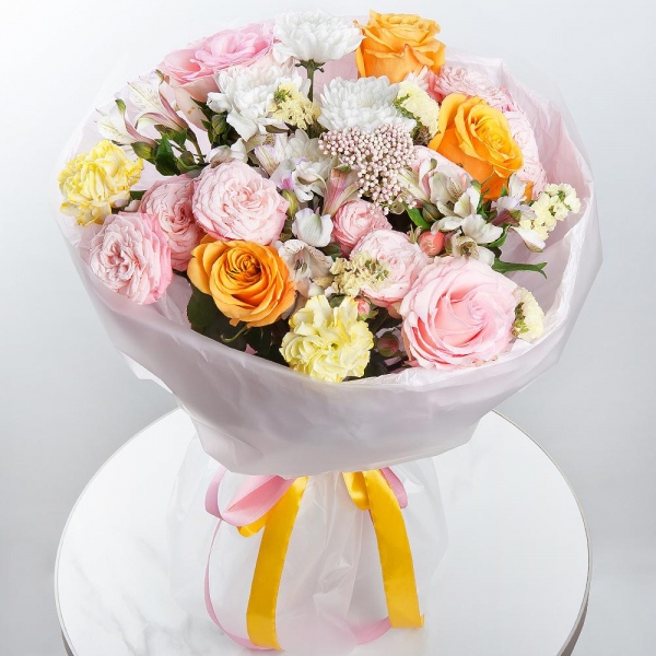 Yellow rose 50 cm - 5, Pink rose 50 cm - 3, Baltica White Spray Chrysanthemum - 1, Peony sprayrose - 3, Alstromeria white, soft pink - 4, Yellow carnation - 2, Yellow Statice, Ozotamnus, Wrapping Paper
