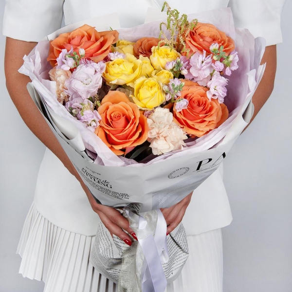 Rose Orange 50 cm Ecuador (High Magic, High Yollow Magic) - 5, Spray rose: yellow, orange 50 cm - 1, Baltica White Spray Chrysanthemum - 1, Carnation white, cream - 6, Matthiola Lilac - 2, Astilbe, Wrapping Paper