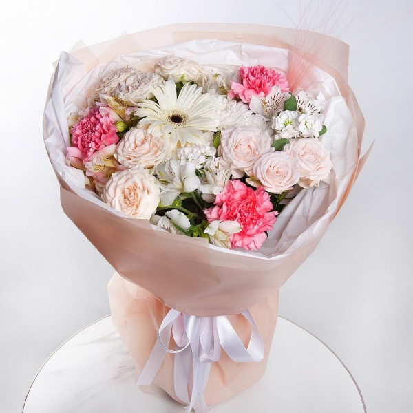 Baltica White Spray Chrysanthemum - 1, Peony sprayrose - 3, Pink carnation - 5, Alstromeria white, soft pink - 3, White Matthiola - 2, Gerbera white - 1, Dried flowers in assortment, Pistachio, Wrapping Paper