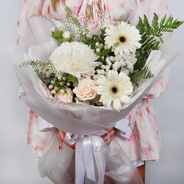 Gerbera white - 4, Magnum White Chrysanthemum - 1, Peony sprayrose - 1, White spray carnation - 2, White Matthiola - 2, Hypericum, White statice, Pistachio, Fern (1 pc.), Green bell (1 pc.), Wrapping Paper