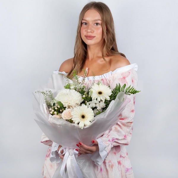 Gerbera white - 4, Magnum White Chrysanthemum - 1, Peony sprayrose - 1, White spray carnation - 2, White Matthiola - 2, Hypericum, White statice, Pistachio, Fern (1 pc.), Green bell (1 pc.), Wrapping Paper