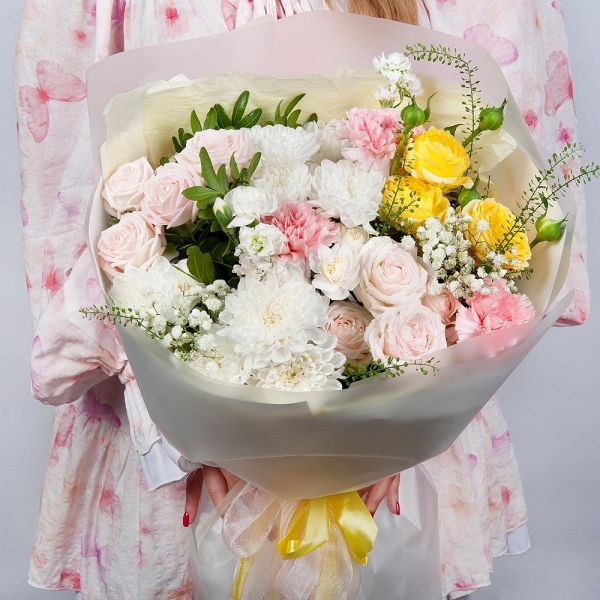 Baltica White Spray Chrysanthemum - 3, Peony sprayrose - 2, Pink carnation - 7, White spray carnation - 4, White Matthiola - 2, Gypsophila - 2, Pistachio, Green bell (1 pc.), Wrapping Paper