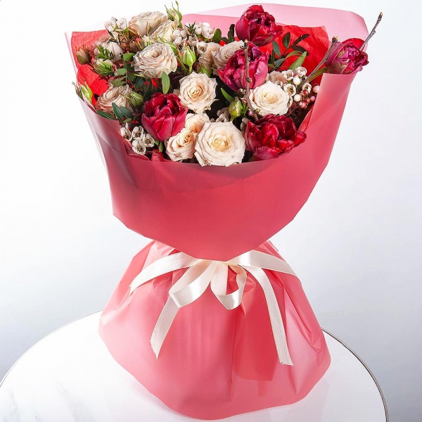 Spray rose: white, cream, light pink 50 cm - 2, Red tulip - 9, Waxflower (1 pc.), Artificial branch, Wrapping Paper, Pistachio