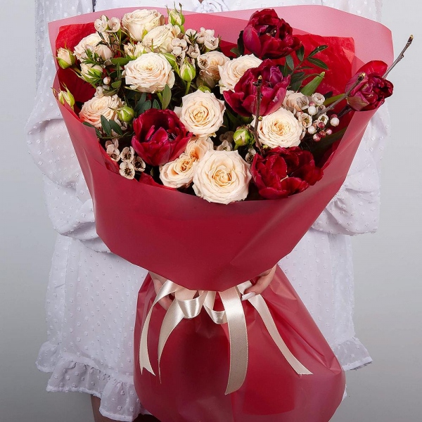 Spray rose: white, cream, light pink 50 cm - 2, Red tulip - 9, Waxflower (1 pc.), Artificial branch, Wrapping Paper, Pistachio