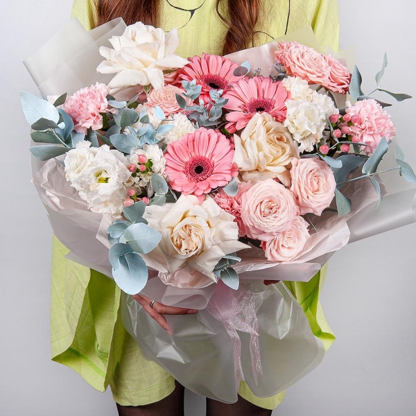 Gerbera pink - 3, Peony style roses - 3, Baltica White Spray Chrysanthemum - 1, lisianthus - 2, Pink carnation - 11, Peony sprayrose - 3, Hypericum, Eucalyptus, Wrapping Paper